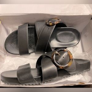 Banana Republic black slides with tortoise circular buckle